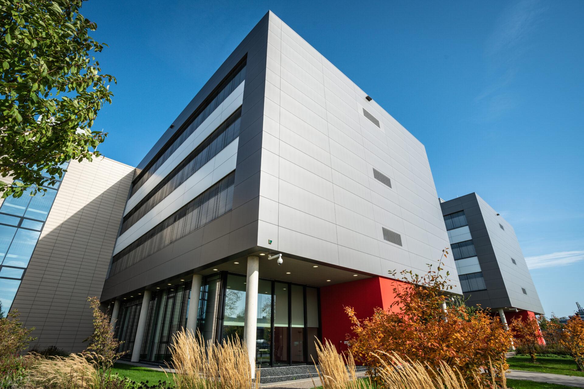 knx modern office building against a nice blue sky